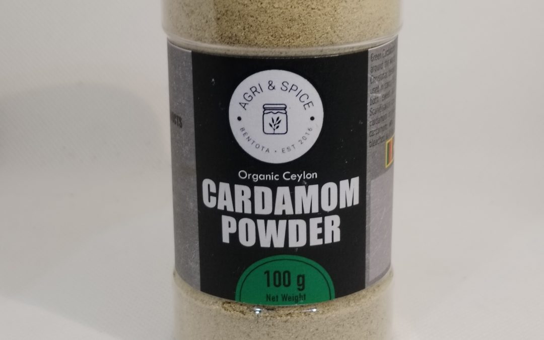 Premium cardamom powder in a sealed spice packet labeled with product details.